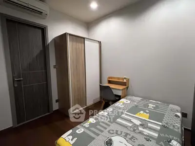 Cozy bedroom with modern furniture and Snoopy-themed bedding, perfect for a comfortable living space.