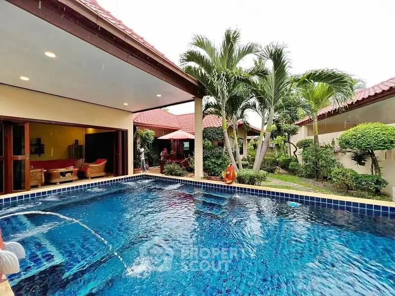 Luxurious villa with private pool and lush garden, perfect for tropical living.