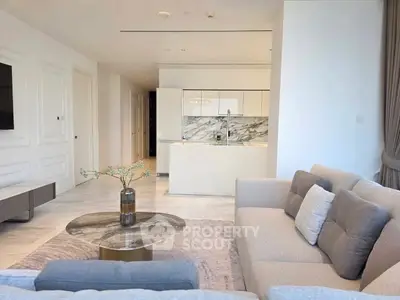 Luxurious open-plan living room with modern kitchen and elegant decor