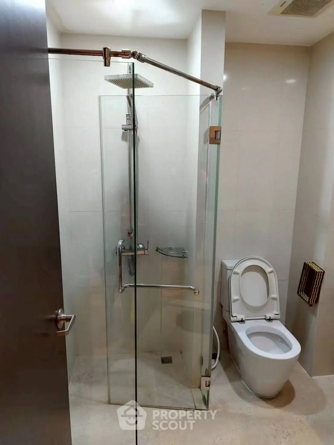 Modern bathroom with glass shower and sleek toilet design