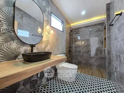 Luxurious modern bathroom with stylish decor and spacious shower area