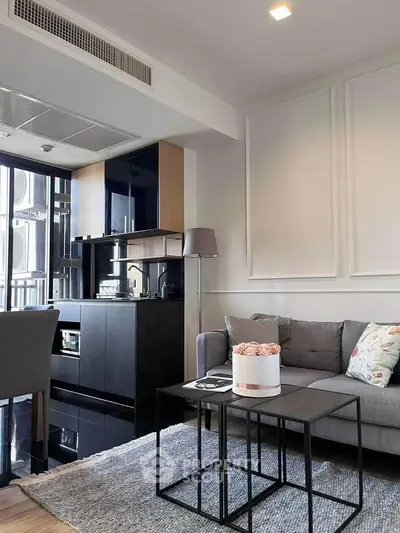 Modern living room with sleek furniture and stylish decor in a contemporary apartment.