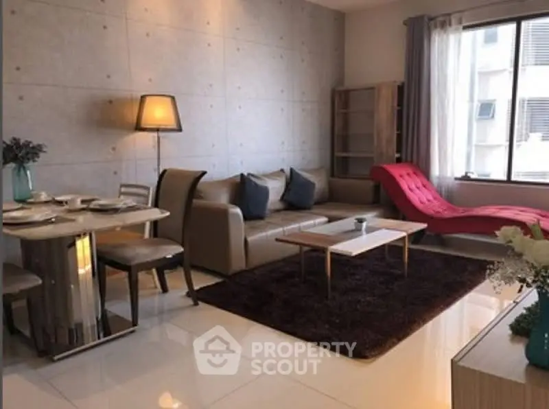 Stylish modern living room with chic decor and ample natural light