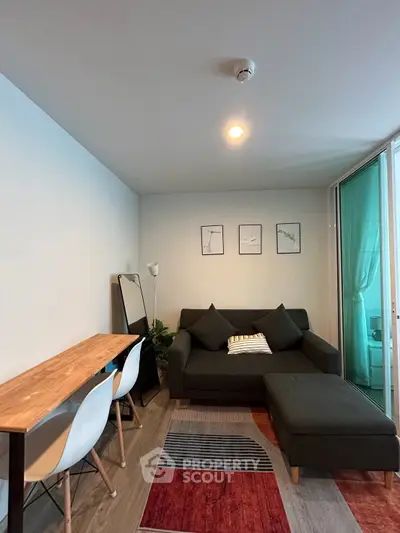 Modern living room with stylish decor and cozy seating area, perfect for relaxation and entertaining.