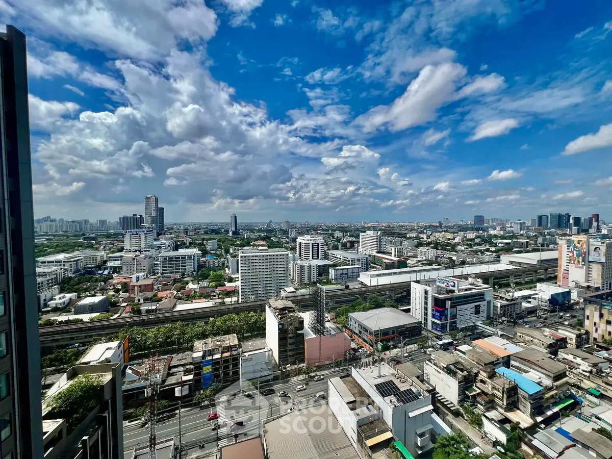 Stunning cityscape view from high-rise building showcasing urban skyline and vibrant city life.