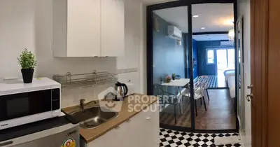 Modern kitchen with open layout and dining area in stylish apartment