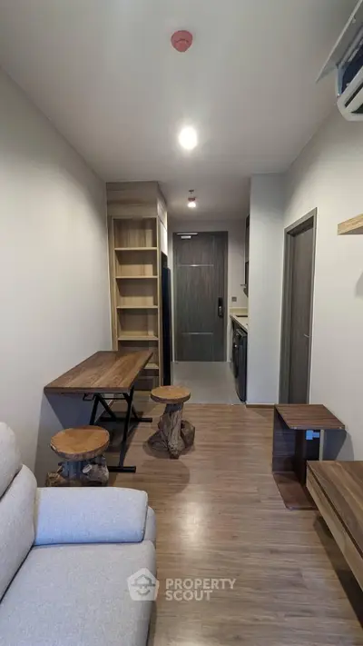 Modern apartment interior with cozy living area and stylish wooden furniture