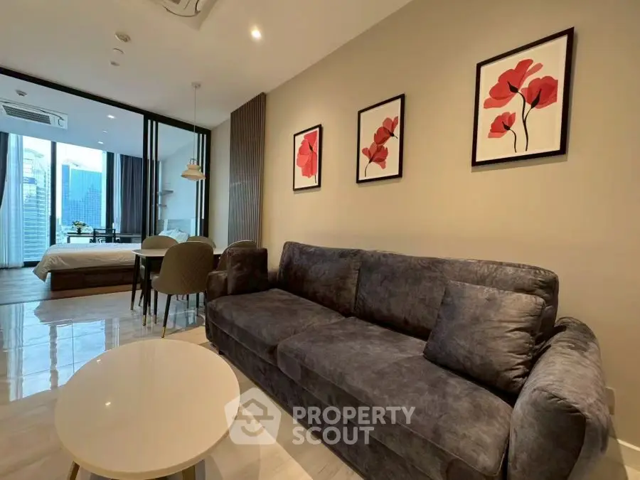 Modern open-plan living room with stylish decor and city view