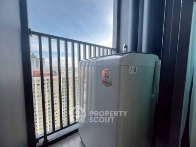 High-rise balcony with washing machine and city view, perfect for urban living convenience.