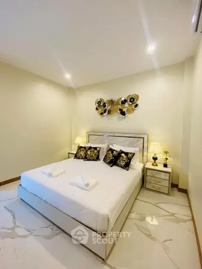 Elegant bedroom with modern decor and luxurious bedding