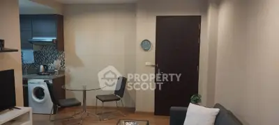 Cozy living room with modern furniture and washing machine in open layout