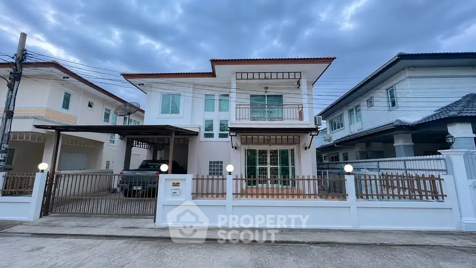 Charming two-story house with modern design and spacious driveway in a serene neighborhood.