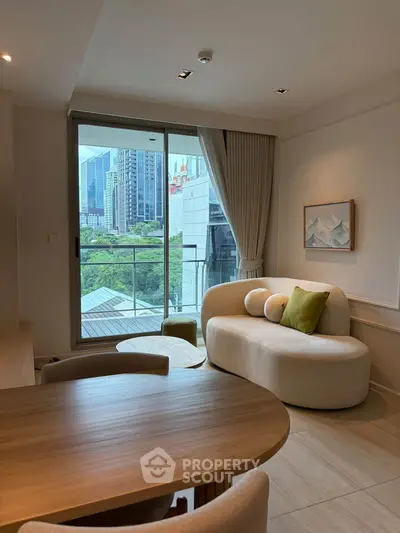 Modern living room with city view, stylish furniture, and large windows for natural light.