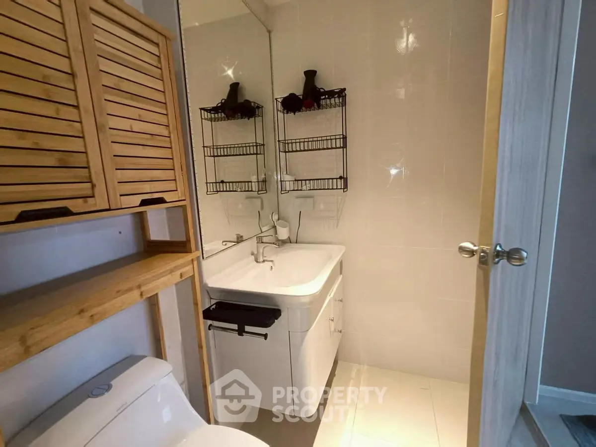 Modern bathroom with sleek fixtures and wooden accents