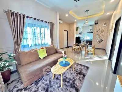 Stylish modern living room with cozy sofa and dining area, perfect for entertaining.