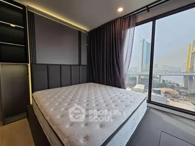 Modern bedroom with stunning city view and large window