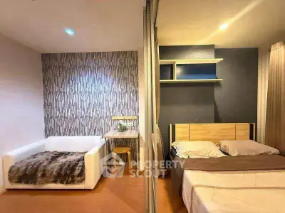 Modern bedroom with stylish decor and cozy seating area, perfect for relaxation and comfort.