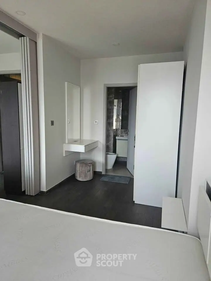 Modern bedroom with ensuite bathroom and sleek minimalist design