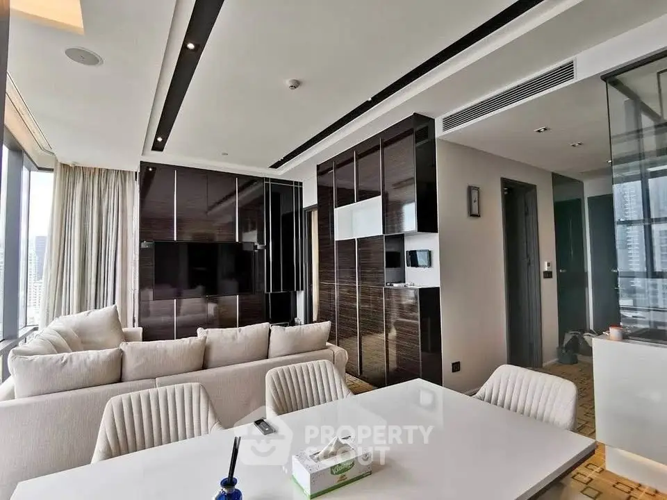 Luxurious modern living room with sleek design and city view, featuring elegant furniture and stylish decor.