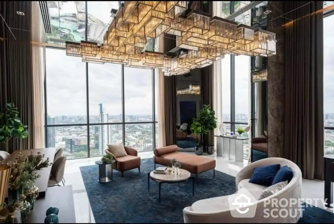 Luxurious high-rise living room with floor-to-ceiling windows offering panoramic city views, complemented by a unique geometric ceiling light fixture and plush furnishings.