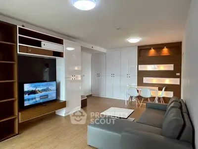 Modern living room with sleek furniture and built-in entertainment center