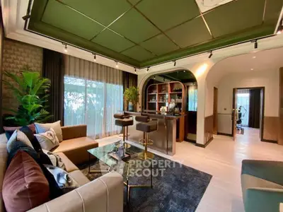 Luxurious living room with stylish bar and elegant decor, perfect for entertaining guests.