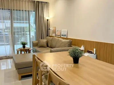 Modern living room with cozy sofa and stylish dining area