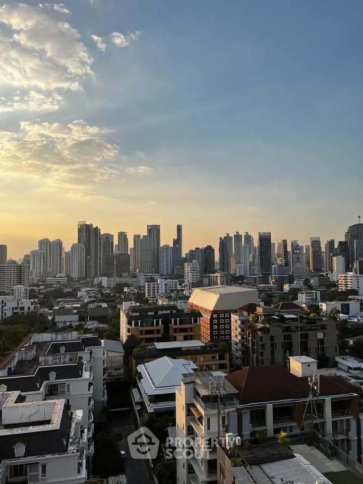 Stunning cityscape view from a high-rise building at sunset, showcasing urban skyline and vibrant architecture.