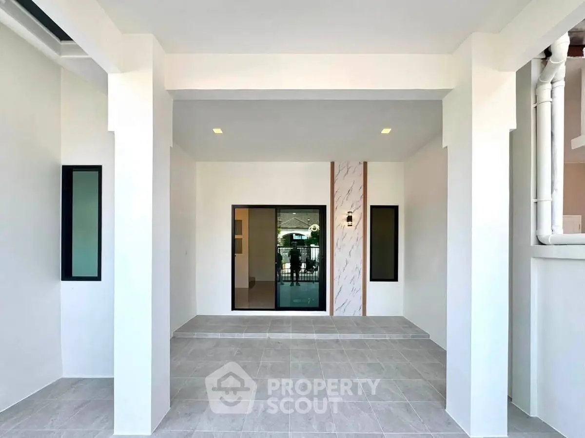 Modern minimalist entrance with sleek design and neutral tones