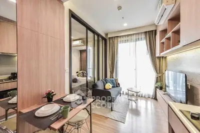 Modern living room with open kitchen in stylish apartment