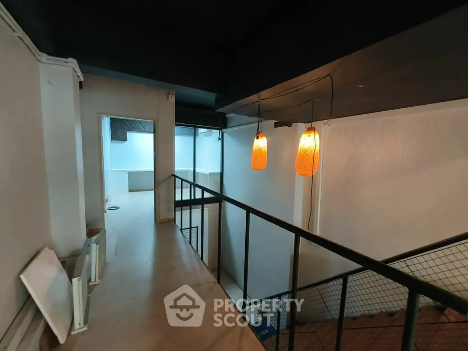 Modern industrial loft with unique lighting and open mezzanine design