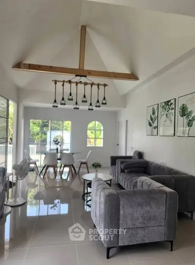 Spacious modern living room with vaulted ceiling and elegant decor