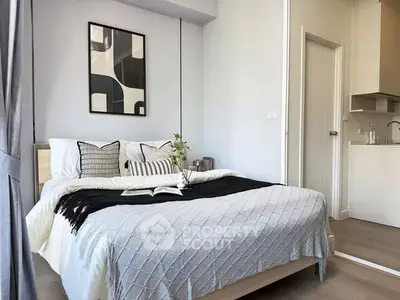 Modern bedroom with stylish decor and cozy ambiance in a contemporary apartment.