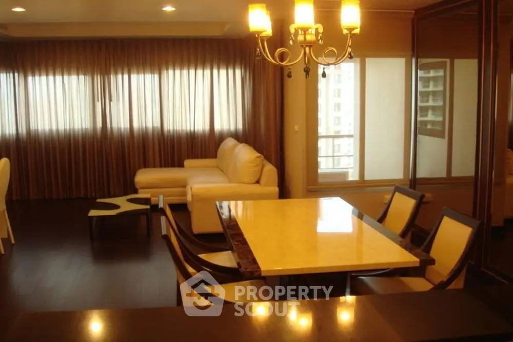 Luxurious living room with elegant chandelier and modern furniture