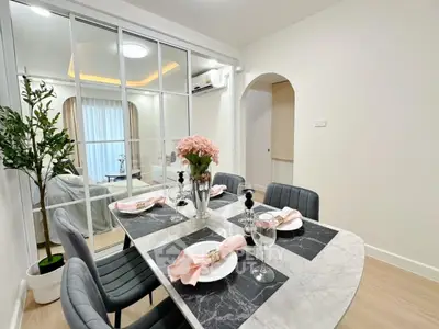 Elegant dining area with marble table and stylish decor in modern apartment
