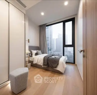 Modern bedroom with city view, featuring sleek design and cozy ambiance, perfect for urban living.