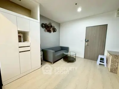 Modern living room with sleek furniture and stylish decor in a contemporary apartment.