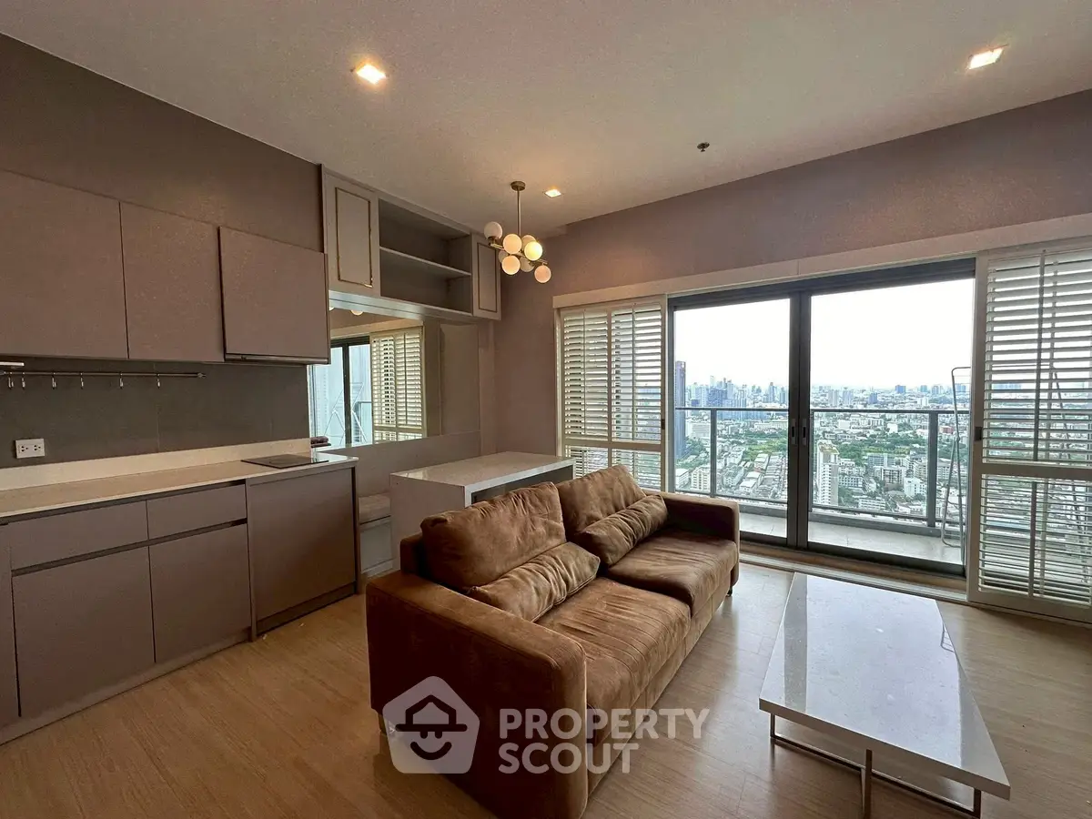 Modern living room with stunning city view and open kitchen layout