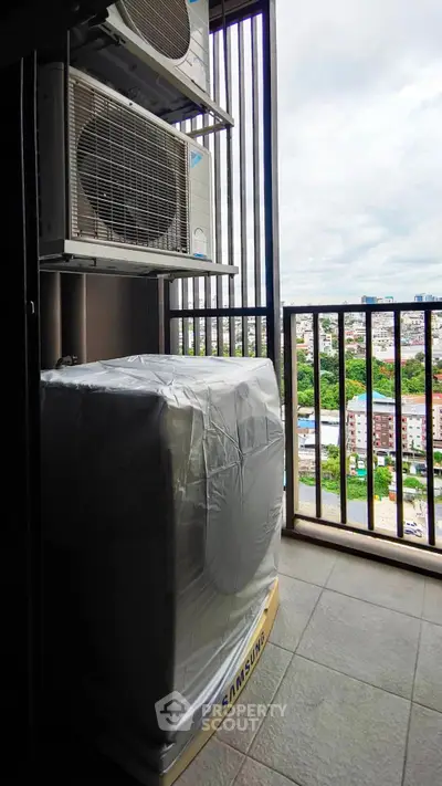 High-rise balcony with city view and air conditioning units, perfect for urban living.