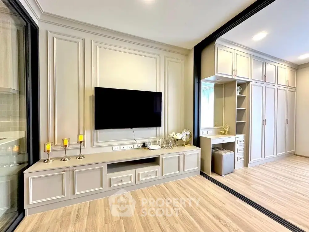 Elegant living room with modern TV setup and stylish cabinetry
