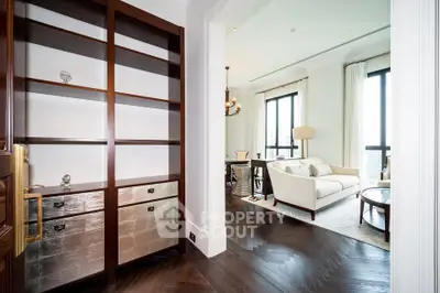 Luxurious living room with elegant shelving and large windows offering abundant natural light.