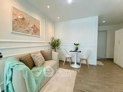 Chic living room with modern decor and cozy seating in a stylish apartment.