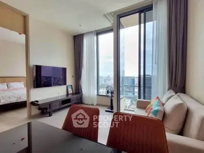 Modern living room with city view, featuring sleek furniture and large windows for natural light.