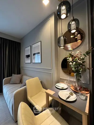 Stylish modern living room with elegant dining area and chic lighting