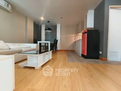 Spacious modern living room with open kitchen and stylish decor
