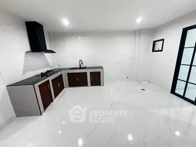 Modern kitchen with sleek design, featuring gas stove and ample cabinetry, perfect for culinary enthusiasts.