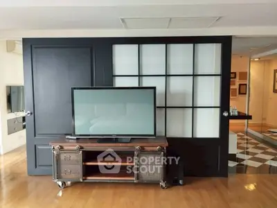 Stylish living room with modern TV stand and sliding glass doors