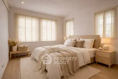 Cozy and inviting bedroom with natural light and elegant decor, perfect for relaxation.