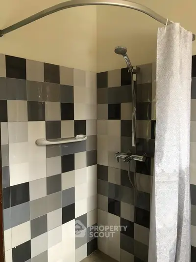 Modern bathroom shower with stylish tile design and sleek fixtures