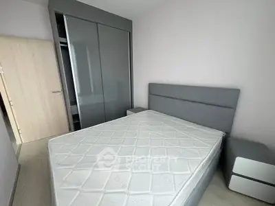 Modern bedroom with sleek gray wardrobe and minimalist design